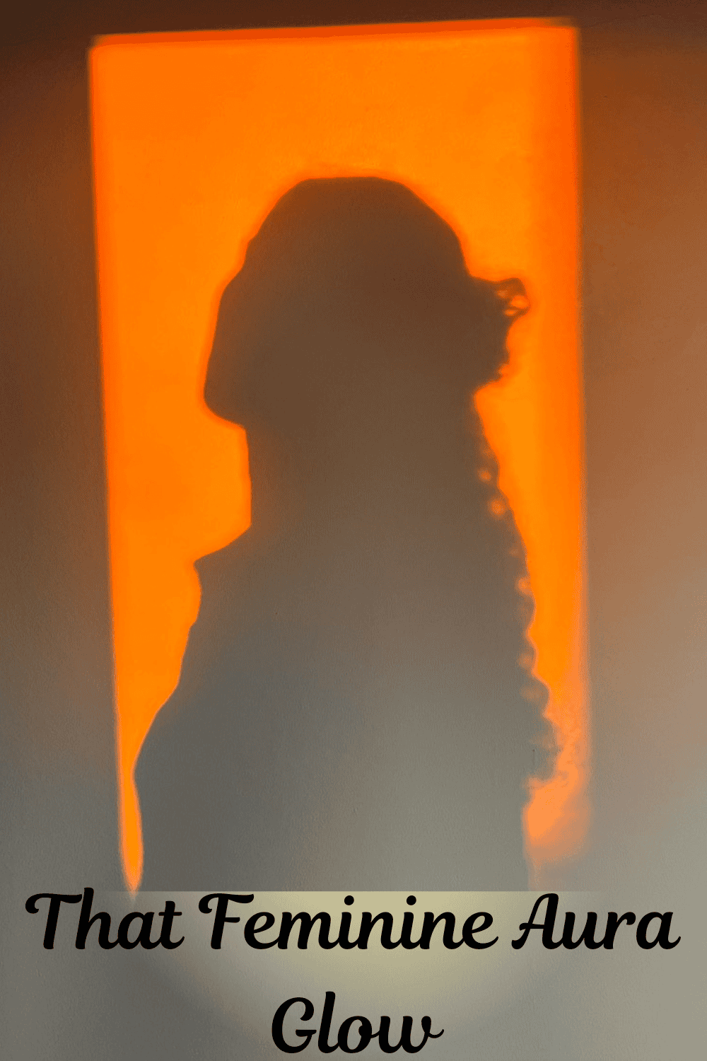 Silhouette profile against a warm orange background.